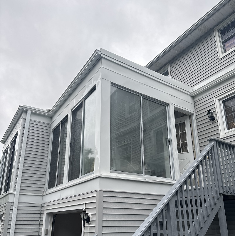 Old sliding patio doors on a porch